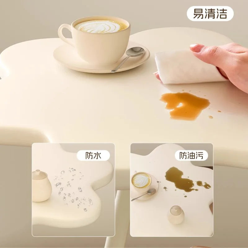 A few cream windblown hair and a few small coffee tables in the living room, a small dining table in the home, a small apartment