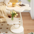 A few cream windblown hair and a few small coffee tables in the living room, a small dining table in the home, a small apartment